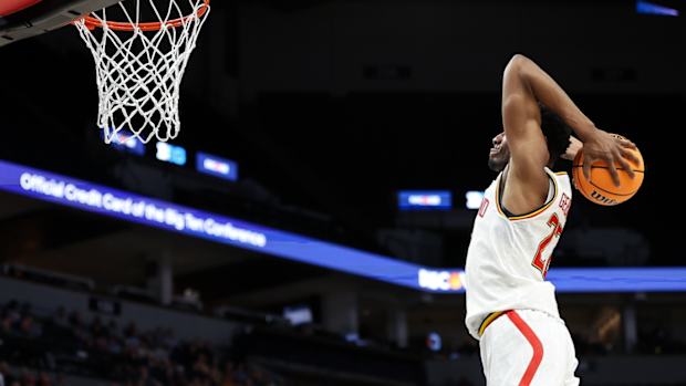 Mar 13, 2024; Minneapolis, MN, USA; Maryland Terrapins forward Jordan Geronimo (22) dunks against the Rutgers Scarlet Knights during the second half at Target Center.